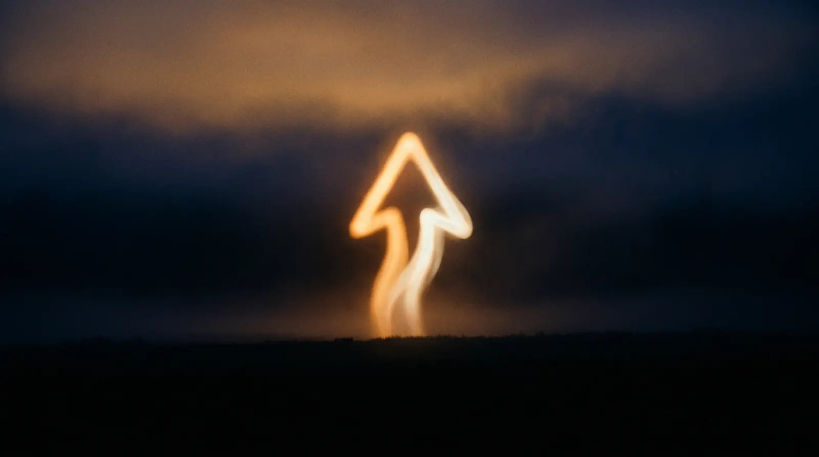 Abstract amber arrow rising from a horizon line into cinematic-dark sky.